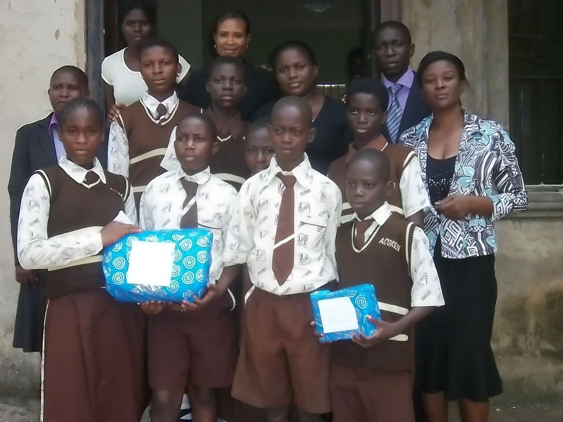 Item-distribution outreach event at a school, with ACUMEN.