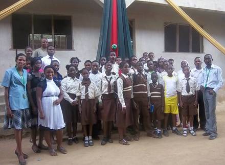 Students and facilitators grouped together after a child rights and responsibilities training session.