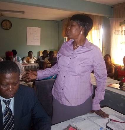 The Director of Community Development addressing participants on behalf of the Delta State Ministry of Women Affairs.