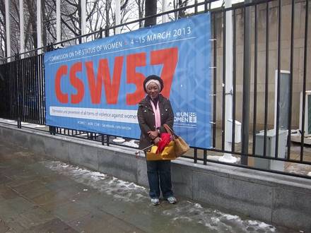 An IMPACT representative standing outside the Commission on the Status of Women at the United Nations.