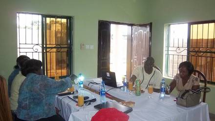 Visitors from EWARDS and USAID meeting IMPACT staff at the IMPACT office.