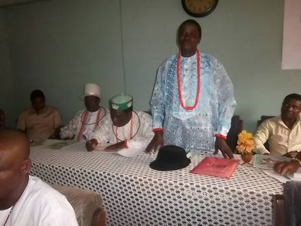 A traditional leader from Isoko community speaking at the dialogue forum.