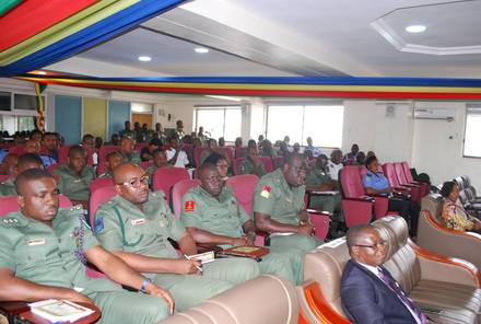 Army officers seated in rows during a seminar session.